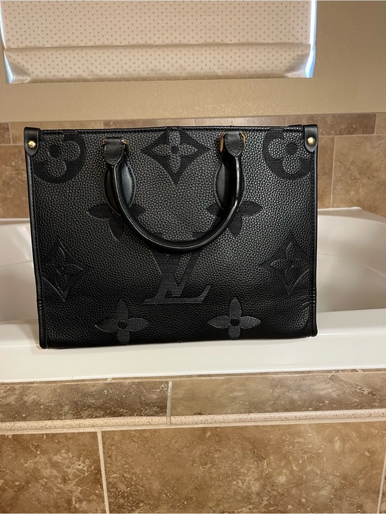 Louis Vuitton Handbags - Authentic Louis Vuitton Black On The Go Embossed Monogram Tote